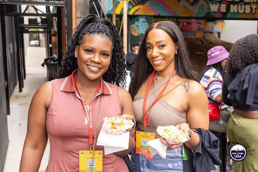 picture of two friends with their taco crawl swag and goodies